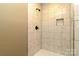 Modern tiled shower showcasing sleek black fixtures and a convenient niche at 209 W Marsh St, Salisbury, NC 28144
