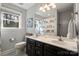 Traditional bathroom featuring double vanity, shower-tub, and window at 2315 Perry Rd, Denver, NC 28037
