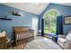 Bright Bedroom with a blue accent wall, vaulted ceiling, and large window at 2315 Perry Rd, Denver, NC 28037