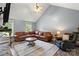 Spacious living room with vaulted ceilings, plush seating, a ceiling fan, and natural light at 2315 Perry Rd, Denver, NC 28037