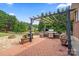 Backyard patio with stone pavers, outdoor grill, and firepit at 2315 Perry Rd, Denver, NC 28037