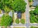 An aerial view of a well-maintained property with a black roof and lush green landscaping at 232 W Wilson Ave, Mooresville, NC 28115