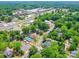Panoramic aerial view of neighborhood with mature trees, houses, and commercial buildings at 232 W Wilson Ave, Mooresville, NC 28115