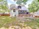 Spacious backyard features a large wooden deck and well-maintained lawn, and fenced yard at 232 W Wilson Ave, Mooresville, NC 28115