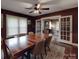 Dining area with hardwood floors and view of living room with open french doors at 232 W Wilson Ave, Mooresville, NC 28115