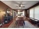 Bright dining room with hardwood floors and an adjacent view of a modern kitchen at 232 W Wilson Ave, Mooresville, NC 28115