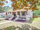 Charming two-story home features a welcoming front porch and a view of the side yard and front yard at 232 W Wilson Ave, Mooresville, NC 28115