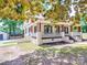 Charming two-story home features a welcoming front porch and a view of the side yard at 232 W Wilson Ave, Mooresville, NC 28115