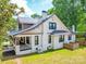 Charming two-story home features a welcoming front porch and well-maintained lawn at 232 W Wilson Ave, Mooresville, NC 28115