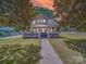 Charming two-story home features a welcoming front porch and meticulously landscaped front yard at 232 W Wilson Ave, Mooresville, NC 28115