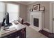 Home office features a desk, fireplace, and an oversized window for ample light at 232 W Wilson Ave, Mooresville, NC 28115