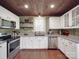 Bright kitchen with stainless steel appliances, white cabinets, and wood ceiling at 232 W Wilson Ave, Mooresville, NC 28115