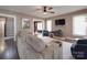 Inviting living room with a fireplace, comfortable sofa, and hardwood floors at 232 W Wilson Ave, Mooresville, NC 28115