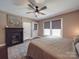The main bedroom features a fireplace, windows for natural light, and calming decor at 232 W Wilson Ave, Mooresville, NC 28115