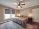 Spacious main bedroom features modern ceiling fan, and plenty of natural light at 232 W Wilson Ave, Mooresville, NC 28115