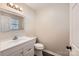 Bathroom features a white vanity, stylish mirror, and modern fixtures at 2424 Pitts Dr, Charlotte, NC 28216