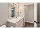 Bathroom featuring a modern vanity, mirror, and a separate toilet area at 2424 Pitts Dr, Charlotte, NC 28216
