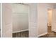 Spacious walk-in closet with ample storage and wood-look flooring at 2424 Pitts Dr, Charlotte, NC 28216