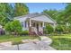 Home with a cozy front porch and beautifully landscaped yard at 2424 Pitts Dr, Charlotte, NC 28216