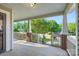 Inviting covered front porch with brick columns and white railing, perfect for relaxing at 2424 Pitts Dr, Charlotte, NC 28216
