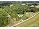 Overhead shot featuring a home with an expansive lawn and a detached garage amidst lush greenery at 2853 Mathis Church Rd, Catawba, NC 28609