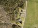 Aerial view showcasing property lines, home layout, and surrounding wooded area at 2853 Mathis Church Rd, Catawba, NC 28609