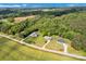 Aerial view of multiple homes nestled among trees and farmland, showcasing a rural community at 2853 Mathis Church Rd, Catawba, NC 28609