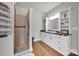 Elegant bathroom boasts a walk-in shower, a lovely vanity with lots of storage and warm wood floors at 2853 Mathis Church Rd, Catawba, NC 28609
