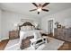 Serene primary bedroom with warm wood tones and a decorative ceiling fan at 2853 Mathis Church Rd, Catawba, NC 28609