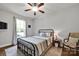 Cozy bedroom has a ceiling fan, a full size bed, and a nice view of the outdoors at 2853 Mathis Church Rd, Catawba, NC 28609