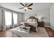Cozy primary bedroom with a decorative ceiling fan and lots of natural light at 2853 Mathis Church Rd, Catawba, NC 28609