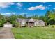Beautiful home featuring a detached two-car garage, well-manicured lawn, and a paved driveway at 2853 Mathis Church Rd, Catawba, NC 28609