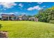 Beautiful home with a well-manicured lawn, screened porch, and detached garage with an attached carport at 2853 Mathis Church Rd, Catawba, NC 28609