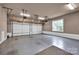 A large two-car garage with two garage doors and shelving provides ample storage and parking space at 2853 Mathis Church Rd, Catawba, NC 28609