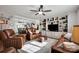 Open-concept living room with decorative built-ins, neutral tones, and comfortable leather seating at 2853 Mathis Church Rd, Catawba, NC 28609