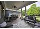 Relaxing screened porch with dining and seating area, perfect for outdoor entertaining and enjoying the landscape at 2853 Mathis Church Rd, Catawba, NC 28609