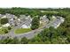 Community aerial view showcasing organized townhome layouts, parking areas, and mature trees at 3021 Misty Harbor Cir, Cramerton, NC 28032