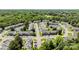 Community aerial showcasing organized townhomes, ample parking, surrounded by lush greenery at 3021 Misty Harbor Cir, Cramerton, NC 28032