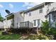 Backyard with raised deck and shed, showcasing a level yard with established trees at 3021 Misty Harbor Cir, Cramerton, NC 28032