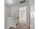 Second floor hallway with access to a bedroom featuring a ceiling fan at 3021 Misty Harbor Cir, Cramerton, NC 28032