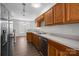 Functional kitchen with stainless steel appliances, wood cabinets, and neutral countertops at 3021 Misty Harbor Cir, Cramerton, NC 28032