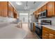 Well-equipped kitchen with stainless steel appliances, wood cabinets, and a functional layout at 3021 Misty Harbor Cir, Cramerton, NC 28032