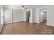 Bright living room with wood floors and open access to an additional room in the home at 3021 Misty Harbor Cir, Cramerton, NC 28032