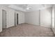 Spacious primary bedroom with tray ceilings and a ceiling fan at 3021 Misty Harbor Cir, Cramerton, NC 28032