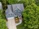 Aerial view of the home featuring a beautifully landscaped yard, inviting entrance, and well-maintained exterior at 3133 English Sparrow Ln, Charlotte, NC 28210