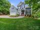 Charming two-story home with a well-manicured lawn and inviting curb appeal at 3133 English Sparrow Ln, Charlotte, NC 28210