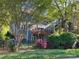 Charming backyard exterior of home, featuring a spacious deck overlooking the lush landscaped yard and privacy fence at 3133 English Sparrow Ln, Charlotte, NC 28210
