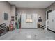 Organized garage with custom white cabinets, workbench, and ample storage space for tools and equipment at 3133 English Sparrow Ln, Charlotte, NC 28210
