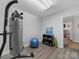Home gym area featuring a heavy bag, exercise ball, shelving, and laminate floors for fitness enthusiasts at 3133 English Sparrow Ln, Charlotte, NC 28210