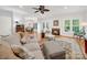 Open concept living room with fireplace and view into the dining and kitchen at 3133 English Sparrow Ln, Charlotte, NC 28210